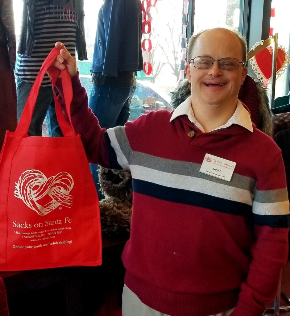 David Holding Red Sacks Bag